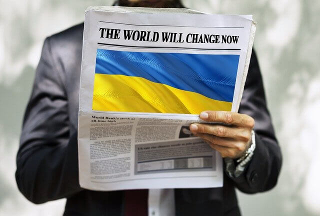 Newspaper with Ukranian flag and the headline "The World Will Change Now"